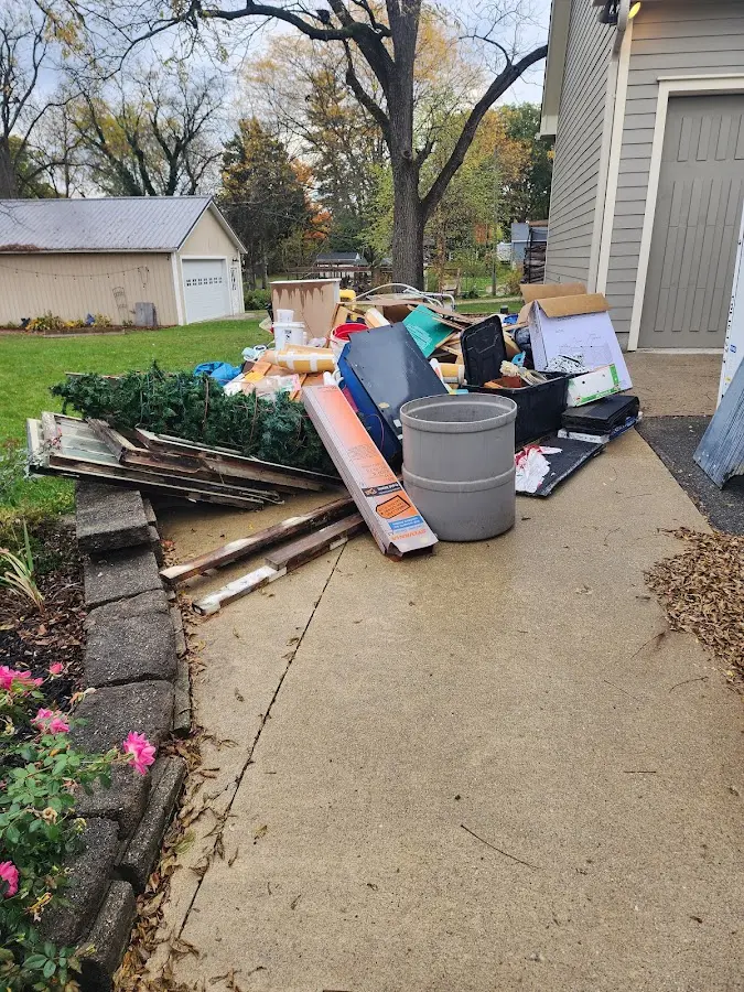 Dumpster being loaded with debris for Residential Dumpster Rental in Wilmington